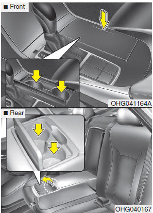 Cups or small beverage cans may be placed in the cup holders