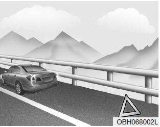 1. Park on a level surface and apply the parking brake firmly.