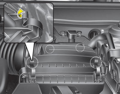 1. Loosen the air cleaner cover attaching clips and open the cover.