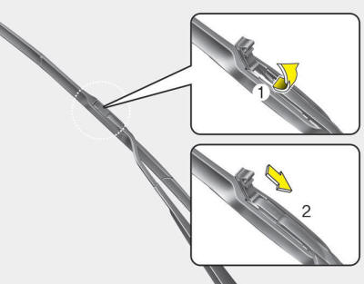 2. Lift up the wiper blade clip. Then pull down the blade assembly and remove